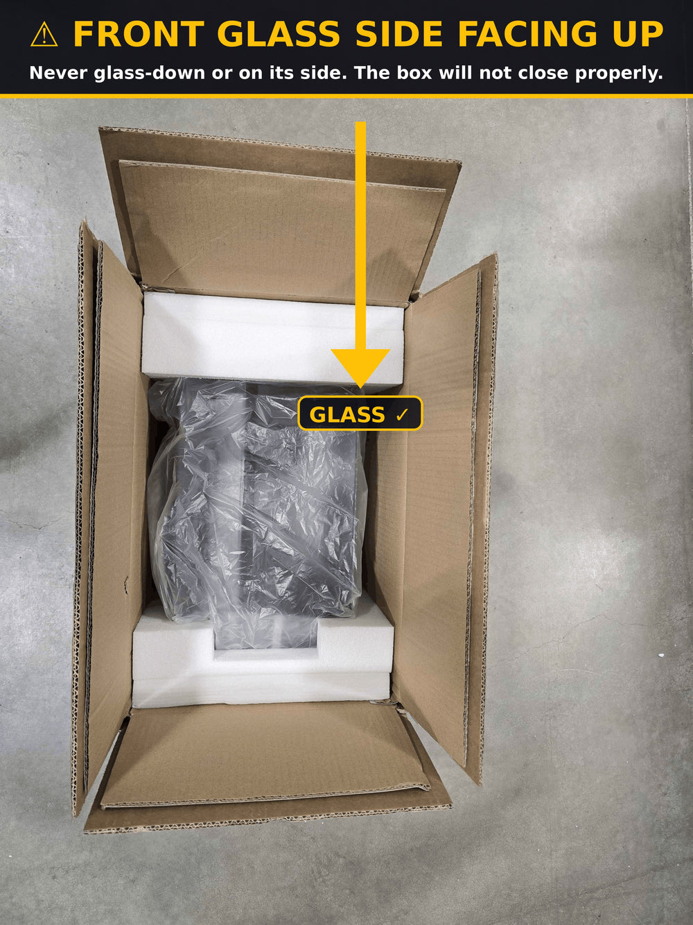 IMPORTANT: Lay the PC flat with the front glass facing UP toward the box opening. Glass-down or sideways will not fit 1:1 and can crush the box.